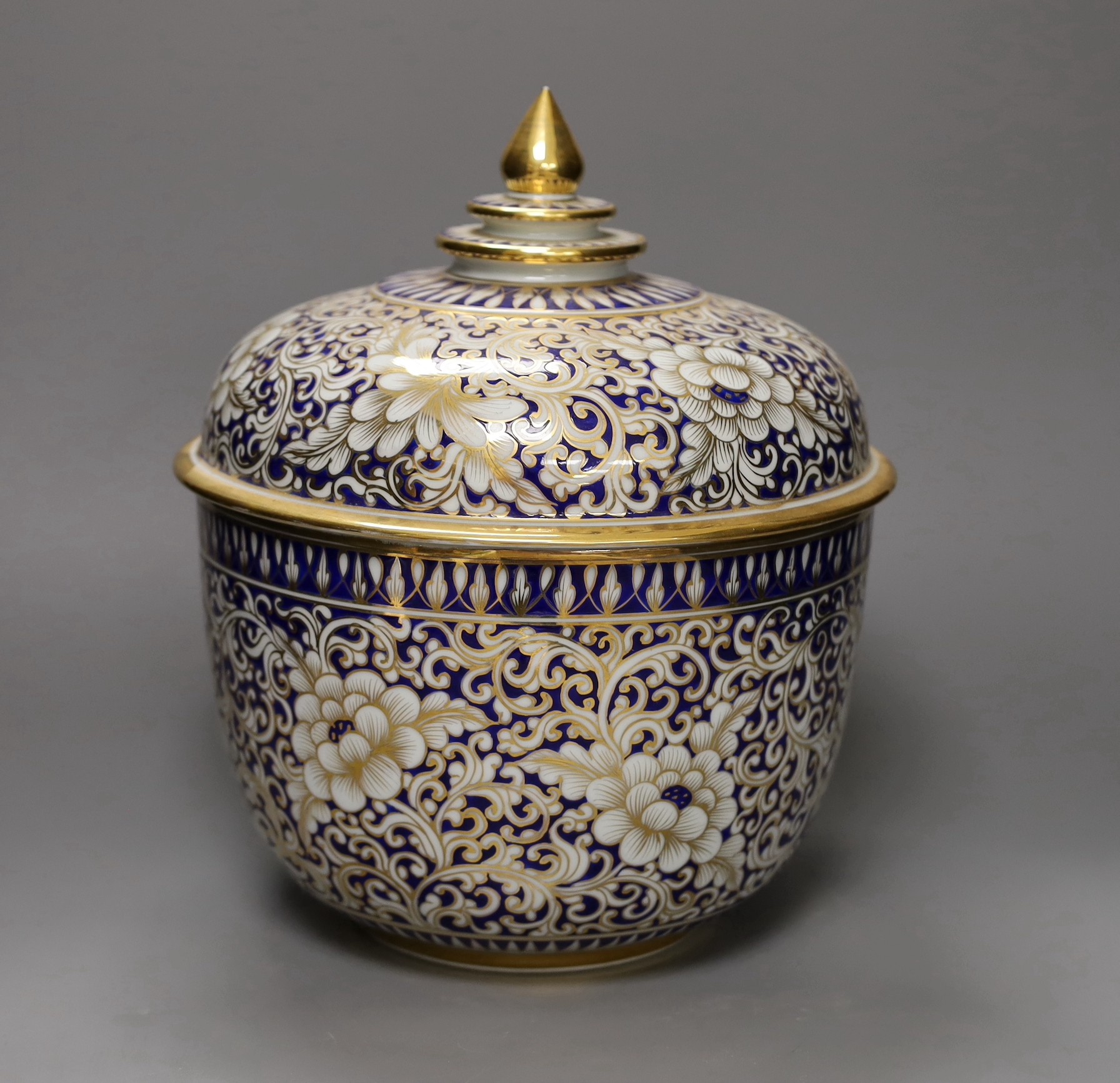 An ornate Continental porcelain bowl and cover, 29cm